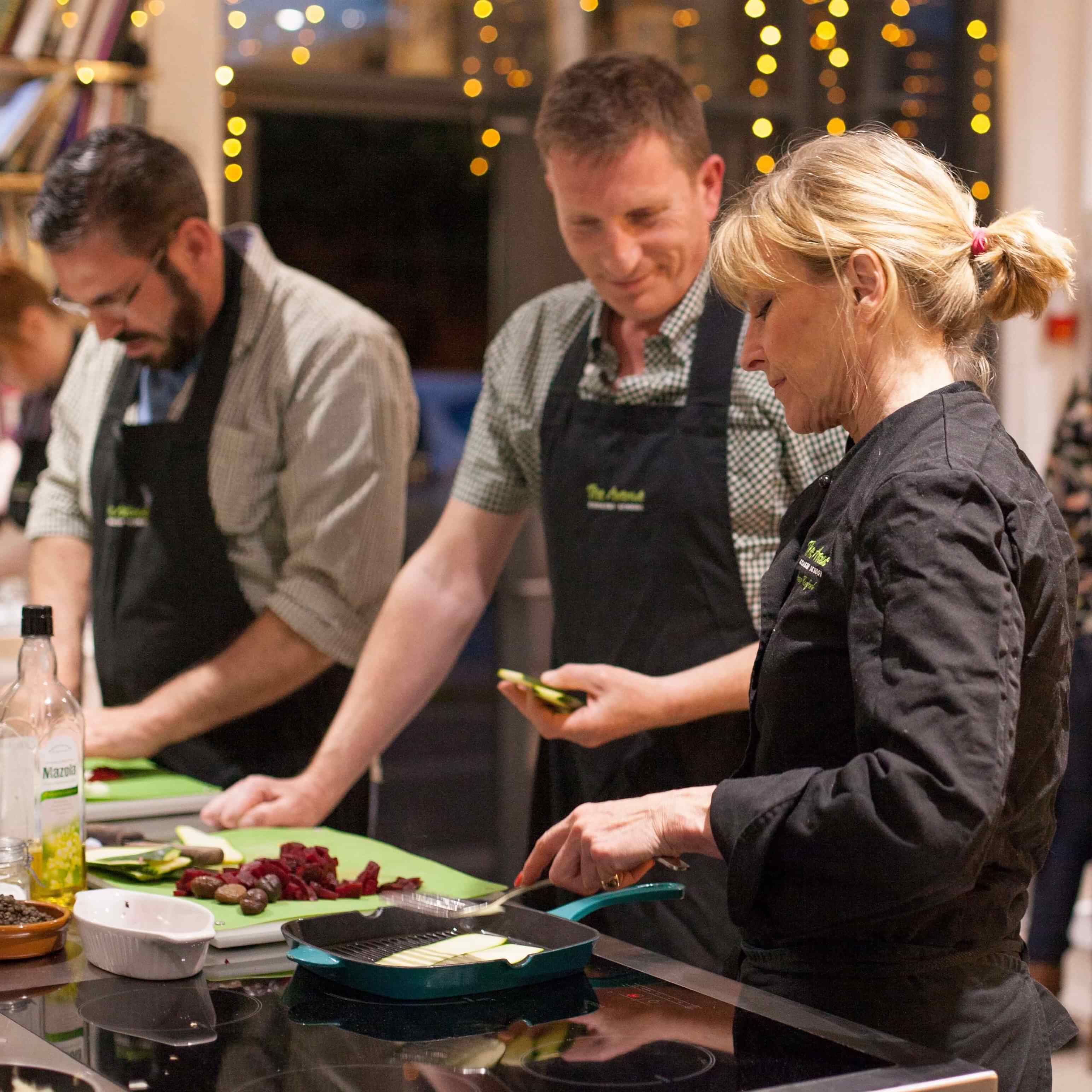 Diana and man cooking courgette (Mikey)