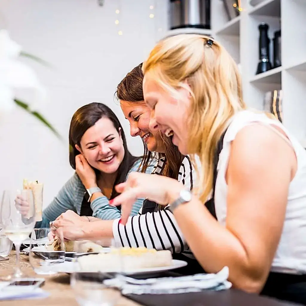 women at the table laughing (jax)